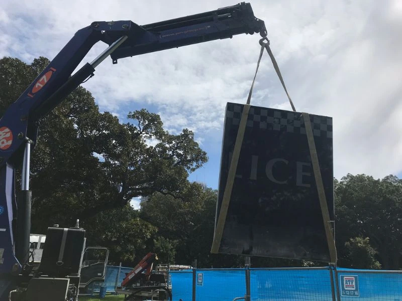 A crate is holding the police monument